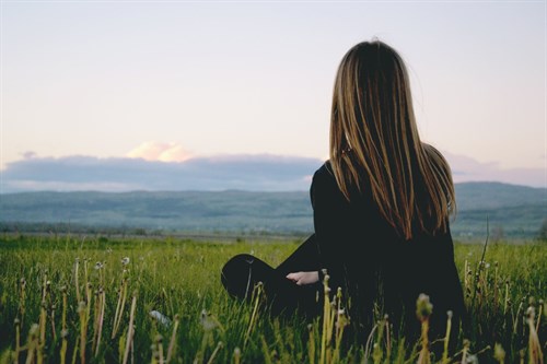 Woman Wearing Black Long Sleeved Shirt Sitting On Green 691919